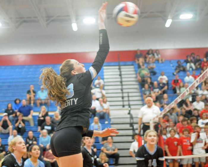 Hagerty's Jenness Orcutt goes against a Lake Brantley blocker during their Region 1-7A final match on Wednesday. Orcutt had 11 kills and six blocks in Hagerty's victory.